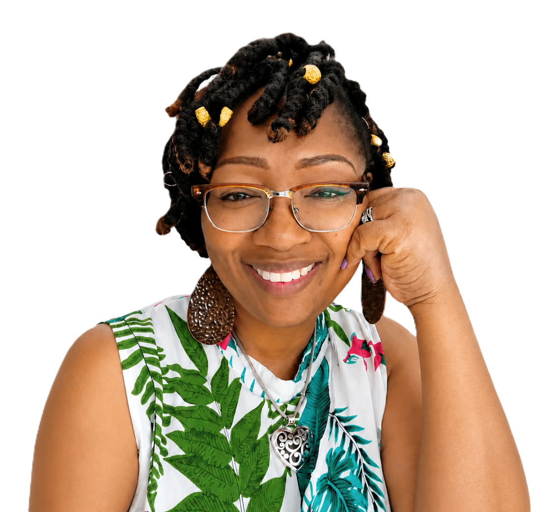 Mellanie T. Grier smiling in glasses and a white, leaf-print top