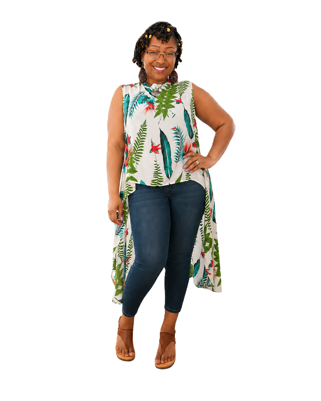 Full-length photo of Mellanie T. Grier smiling in a long leaf-print top, jeans and sandals